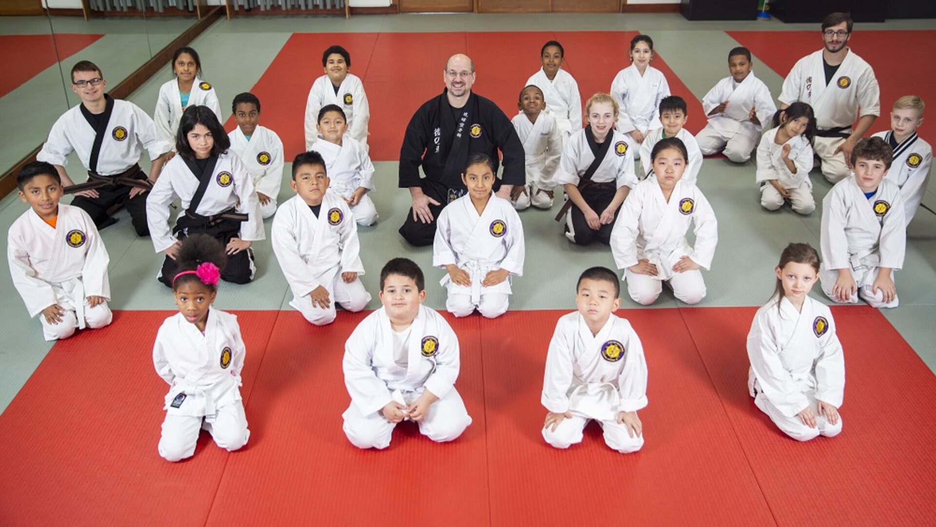 Kids cheering on the mat at Go No Sen Karate summer camp in Peekskill
