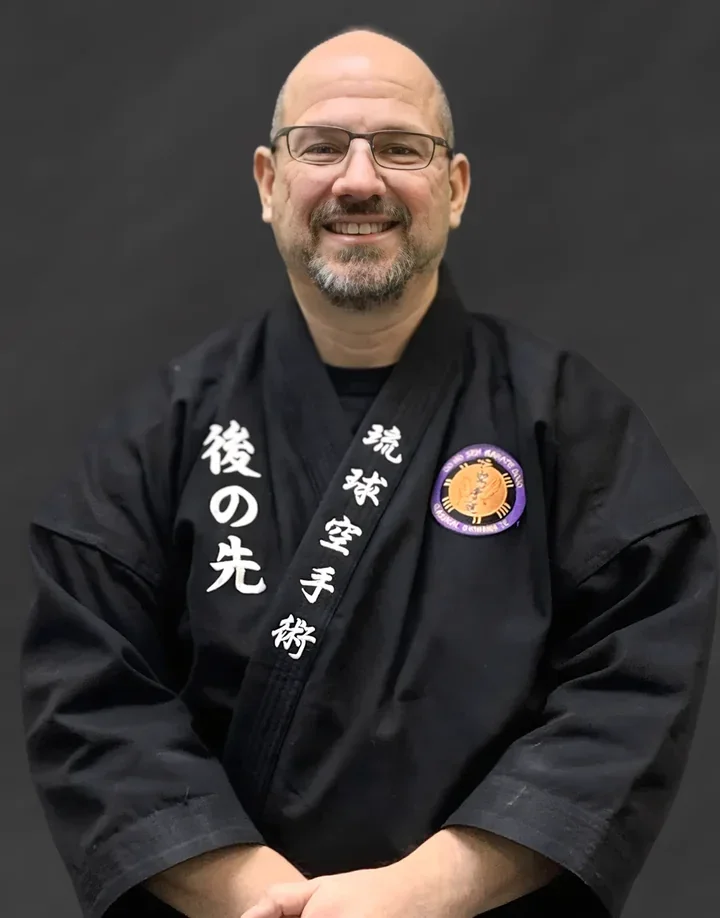 Kyoshi Adam McCauley, Founder & Owner at Go No Sen Karate, coaching a student